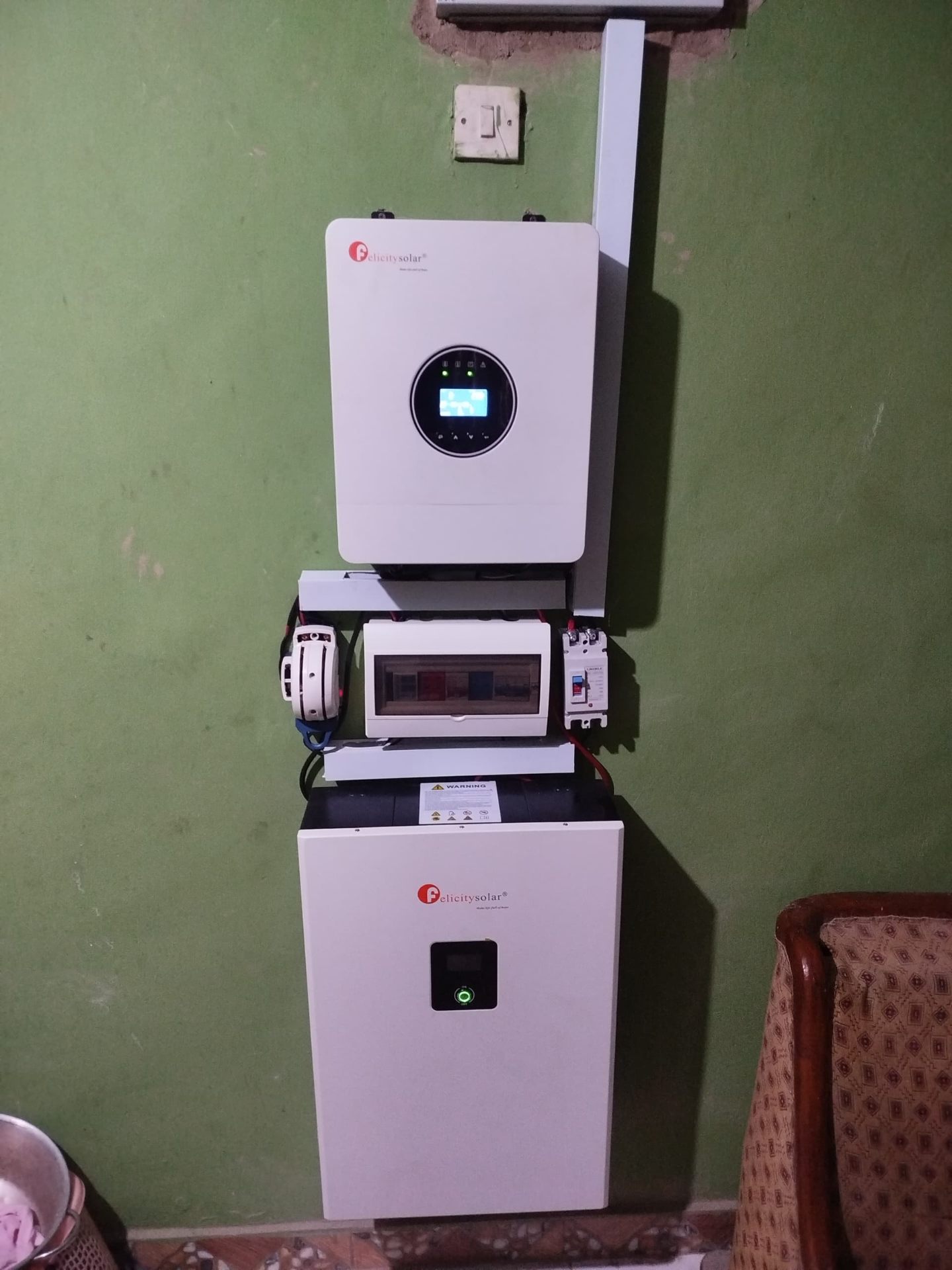 Hybrid inverter and lithium battery installed on a wall by Samright Technology