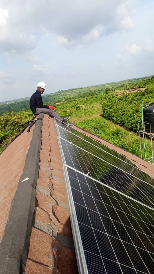 Samright technician installing solar panels on a residential roof